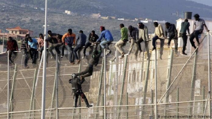 Migrants-from-Morocco-scale-fence-into-Spain-2