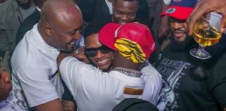 Video: Moment Davido and Wizkid spotted having fun, hugging each other at Lagos club